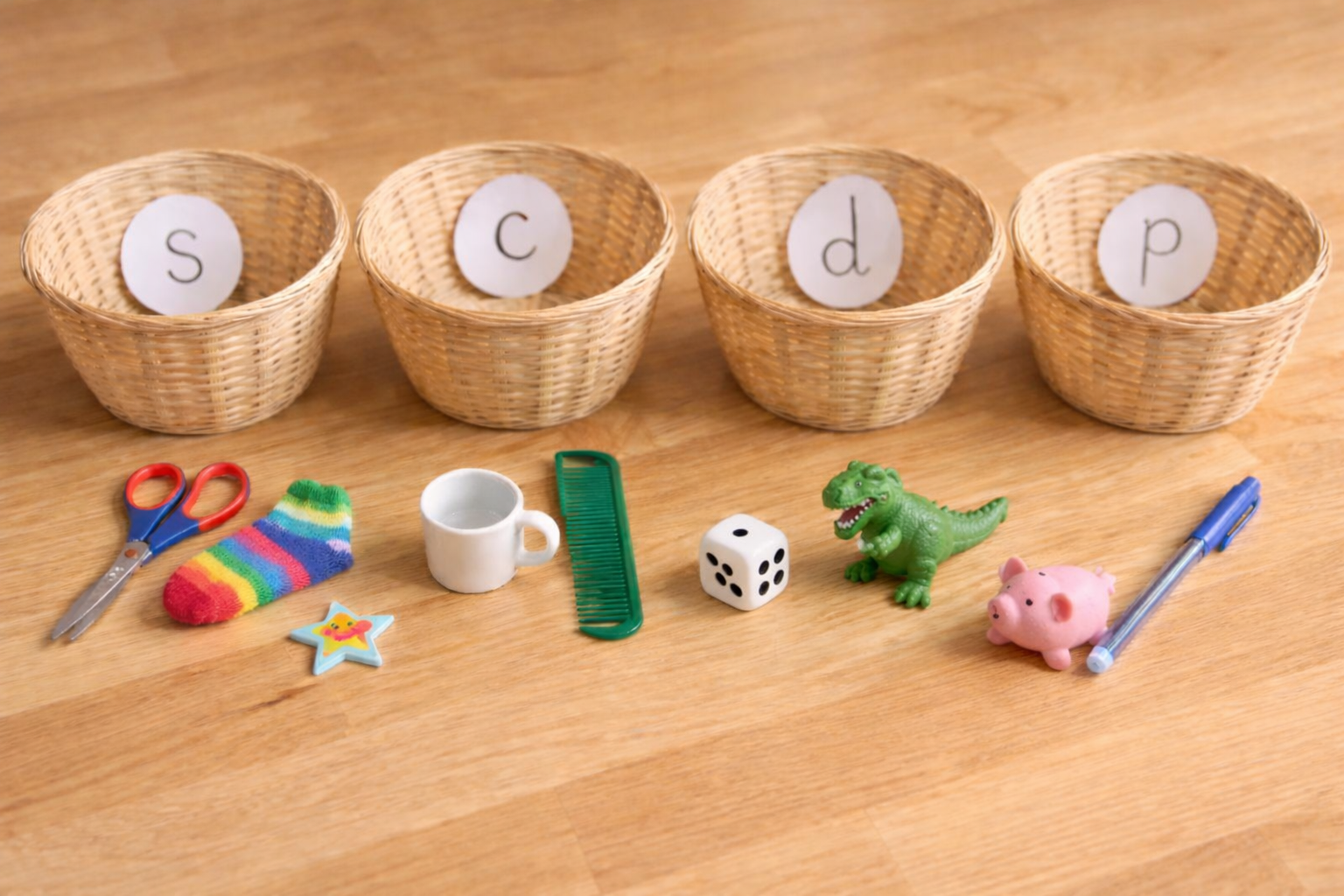 Child identifying initial sounds in a phonics activity